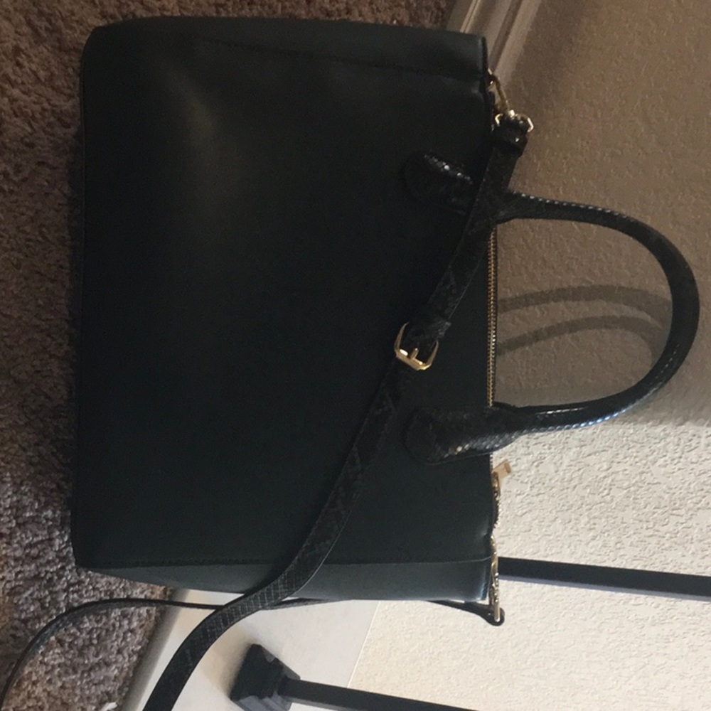 I am selling a green bag with alligator skin bag